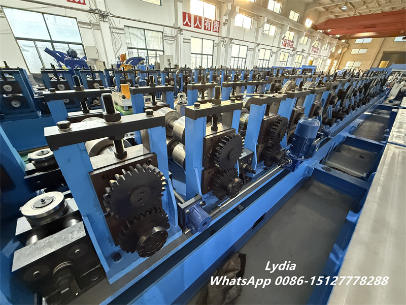 Professional C Z purlin making machine showing roll forming stations and chain drive system