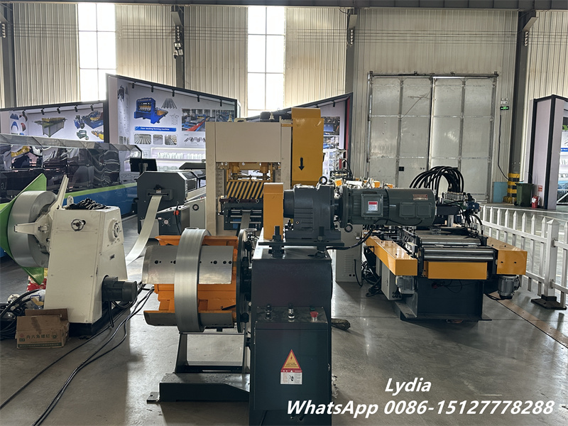 Metal perforated machine line running in factory workshop
