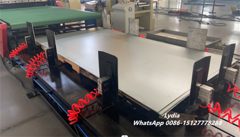 automatic stacking system for cut to length line sheet metal conveyor and collection table